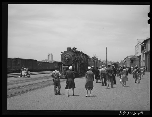 These four photographs were taken at the railroad station when a noon train came in. All trains coming into San Diego are crowded and are an indication of the hordes of people pouring into the city. California