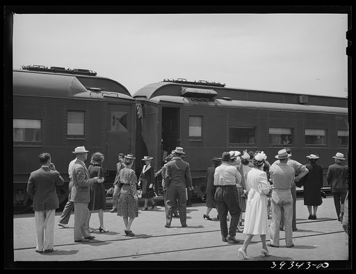 These four photographs were taken at the railroad station when a noon train came in. All trains coming into San Diego are crowded and are an indication of the hordes of people pouring into the city. California