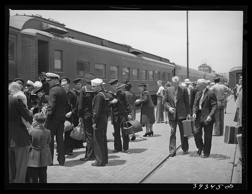 These four photographs were taken at the railroad station when a noon train came in. All trains coming into San Diego are crowded and are an indication of the hordes of people pouring into the city. California