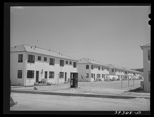 The rear of a multiple family dwelling. Navy defense housing for Marine and Naval enlisted men and a few civilian workers at the Marine and Naval bases. San Diego, California