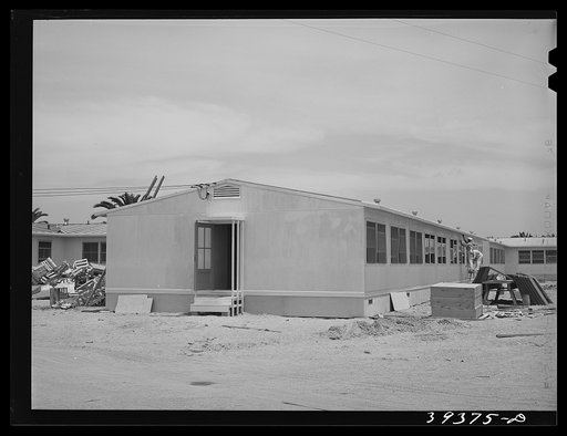 Painters working on dormitories at the FSA (Farm Security Administration) camp for defense workers. Dormitories are being rented to men working in certain specified defense industries and the men must have been living in either substandard housing or who have been commuting long distances to their j