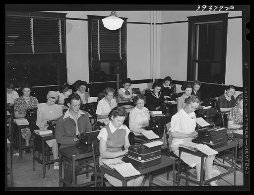 Typing class at the San Diego Vocational School. During the day high school graduates attend this school. The night classes are attended by persons having jobs. San Diego, California