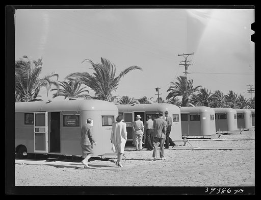 Untitled photo, possibly related to: Family moving into trailer at the FSA (Farm Security Administration) camp for defense workers. This family is from Minnesota. The man came to San Diego ten months ago and enrolled in a vocational school. He started to work at Consolidated Aircrafts as a riveter a