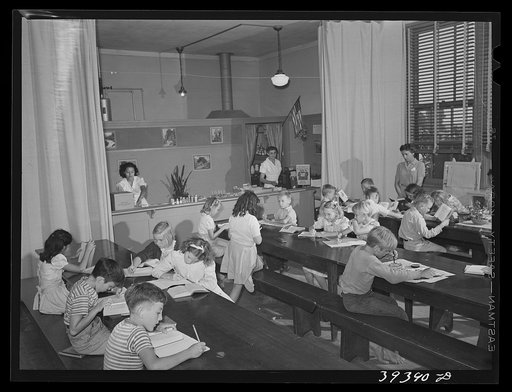 Second and third grades at the Balboa School, San Diego, attend classes held in the cafeteria of the school. San Diego, California