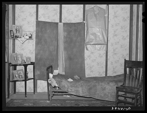 Living room in house rented to Mexican family for twelve dollars and fifty cents per month. San Diego, California