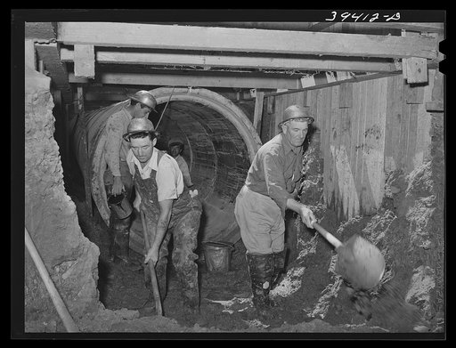 Excavating work, construction of sewage lines and sewage disposal plant, a WPA (Work Projects Administration) national defense project sponsored by the city of San Diego. All excavating on this project up to date has been done by hand--but big equipment is now being moved in. San Diego, California