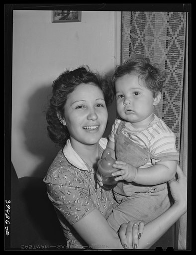 Mother and child who have moved to San Diego from San Angelo, Texas. The house this family lives in rented for twenty-two dollars and fifty cents per month six months ago. The rent is now forty dollars. Two roomers pay five dollars each per month for use of room. San Diego, California