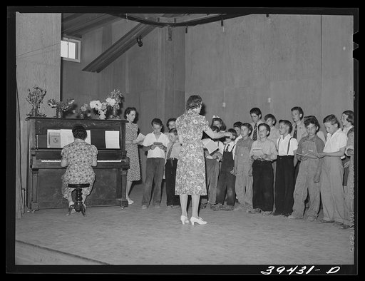 Untitled photo, possibly related to: Schoolchildren and their teacher in program at the end of school term. FSA (Farm Security Administration) labor camp. Caldwell, Idaho