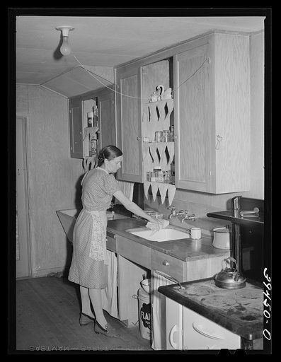 Wife of farm worker in kitchen of her cottage. Her husband is a "permanent" farm worker and they live in one of the cottages at the FSA (Farm Security Administration) labor camp. Caldwell, Idaho