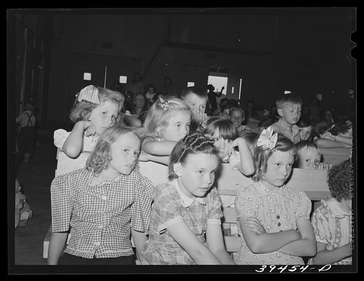Schoolchildren watching the program given at the end of the school term.  FSA (Farm Security Administration) labor camp. Caldwell, Idaho
