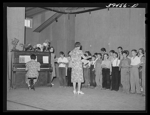 Schoolchildren and their teacher in program at the end of school term. FSA (Farm Security Administration) labor camp. Caldwell, Idaho
