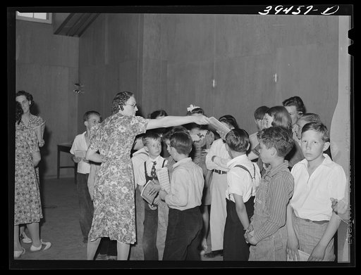 Untitled photo, possibly related to: Schoolchildren and their teacher in program at the end of school term. FSA (Farm Security Administration) labor camp. Caldwell, Idaho