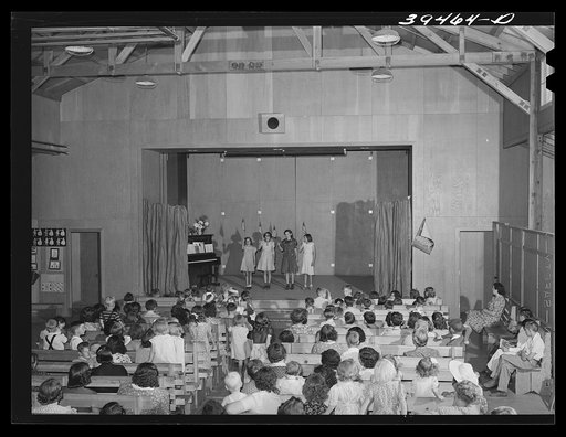 FSA (Farm Security Administration) labor camp. Children watching their schoolmates in a program at the end of the school term