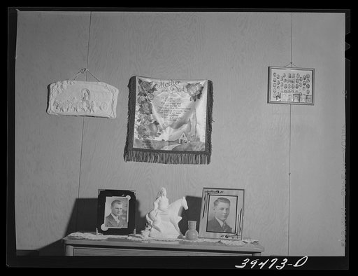 Decorations in cottage home of permanent farm worker at the FSA (Farm Security Administration) labor camp. Caldwell, Idaho