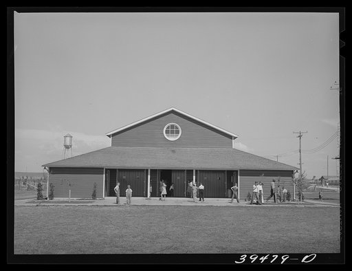 Community hall at the FSA (Farm Security Administration) labor camp, Caldwell, Idaho. Dances, picture shows, programs, a library, sewing classes and lunches for schoolchildren are in this building
