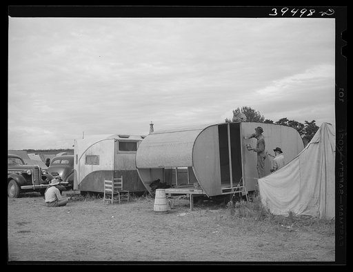 Trailer houses of pea pickers who travel with a labor contractor and live in camp rented and manage by the contractor. Canyon County, Idaho