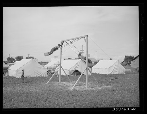 Children playing in mobile unit of FSA (Farm Security Administration) labor camp. Nampa, Idaho