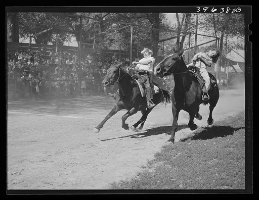 Finish line of farm boys' horse race. Vale Oregon. This was supposed to be a boys race but the girls wanted to be in it too so they were included