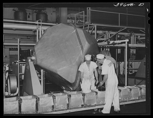 Packing butter into tubs at the Dairymen's Cooperative Creamery. Caldwell, Canyon County, Idaho. This co-op is sixteen years old. During the year of 1940 nearly 4,000,000 pounds of butter fat were received at the creamery