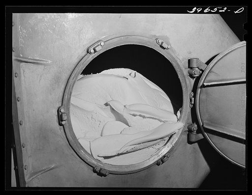 Butter in churn of the Dairymen's Cooperative Creamery. Caldwell, Canyon County, Idaho. Average price paid to members in 1940 was 32.43 cents (including cash dividend) per pound for butter fat. Average price for U.S. was twenty-eight cents