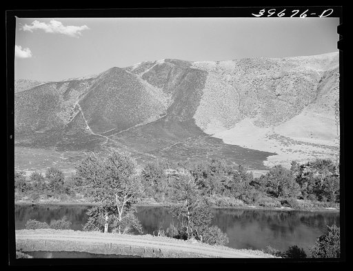 Untitled photo, possibly related to: Mountains in Gem County, Idaho. The darker part is the burned-over grass land. The summers are dry in this section and the fire hazard is high