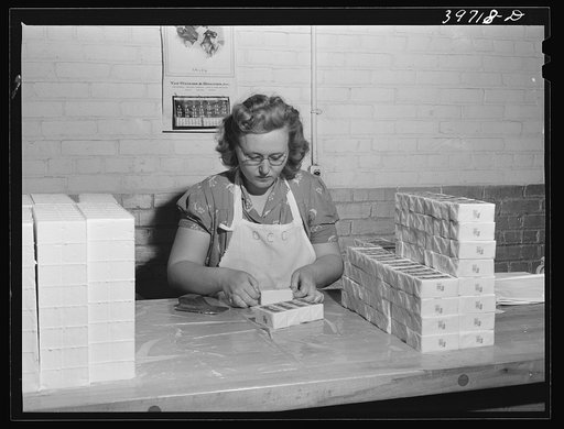 Wrapping quarter pounds of butter at the Dairymen's Cooperative Creamery. Caldwell, Canyon County, Idaho. During 1940, 4,000,000 pounds of butterfat were received by the cooperative