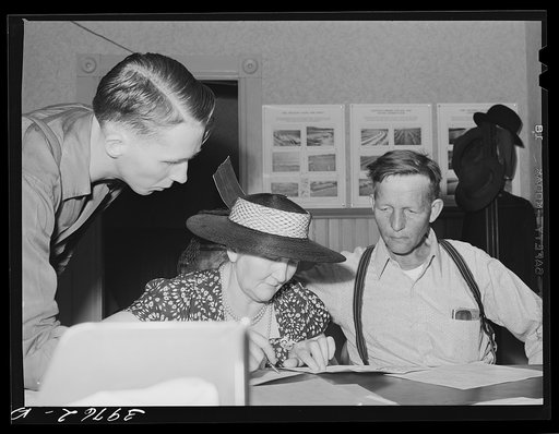 Untitled photo, possibly related to: FSA (Farm Security Administration) clients making plans for farms in county supervisor's office. Grangeville, Idaho