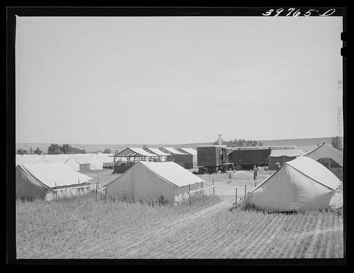 Tents, power unit and laundry shelters at the FSA (Farm Security Administration) migratory farm labor camp mobile unit. Athena Oregon