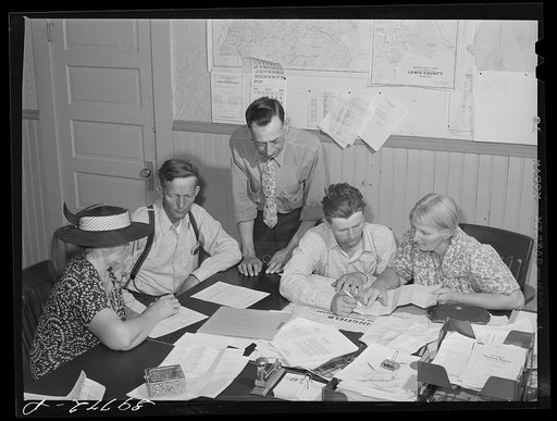 FSA (Farm Security Administration) clients making plans for farms in county supervisor's office. Grangeville, Idaho