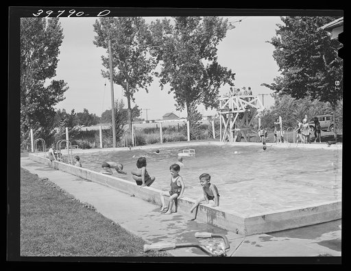 Swimming pool at Athena, Oregon. This pool is near the FSA (Farm Security Administration) migratory labor camp mobile unit and the children of the camp swim and receive swimming lessons three days a week