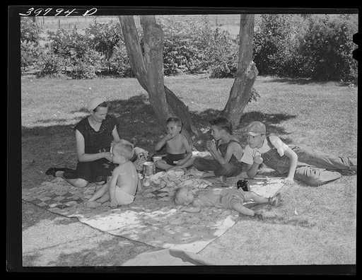Farm workers who live in the FSA (Farm Security Administration) migratory farm labor camp mobile unit  picnic in nearby park. Athena, Oregon