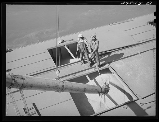 Pouring wheat into hole of barge at Port Kelly, Walla Walla County, Washington