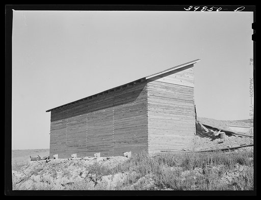 Bulk wheat elevator on farm. This elevator was built from plans drawn up and furnished by the State Extension Service and AAA (Agricultural Adjustment Administration). These farm elevators are designed to take care of the bumper crop of wheat this year for which there is not adequate storage space. 