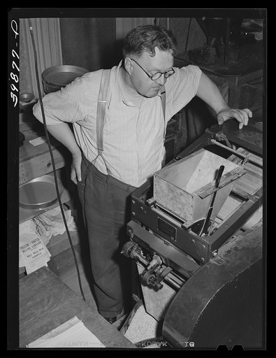 State inspector running dockage test on wheat. Walla Walla County, Washington
