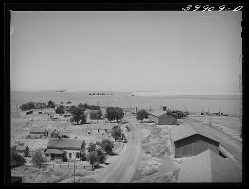 Untitled photo, possibly related to: Eureka, Walla Walla, Washington. This was taken from top of elevator. Notice the sack warehouse along right of road