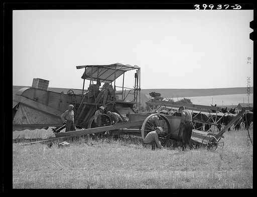 Working on combine. Walla Walla County, Washington