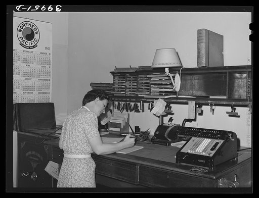 Office worker in wheat broker's office. Whitman County, Washington