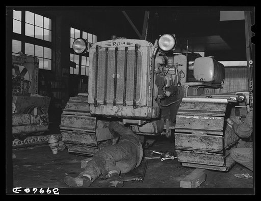 Untitled photo, possibly related to: Caterpillar tractor in repair shop at Colfax, Washington. These tractors are used in the wheat lands