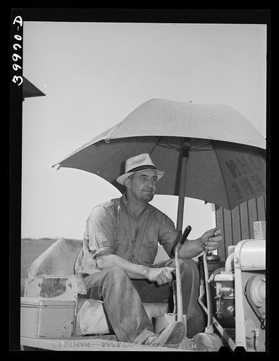 Driver of caterpillar tractor. Wheat field, Whitman County, Washington