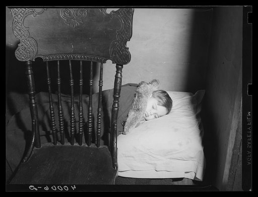 New York, New York.  A boy sleeping at his home on East 62nd (or 63rd) Street