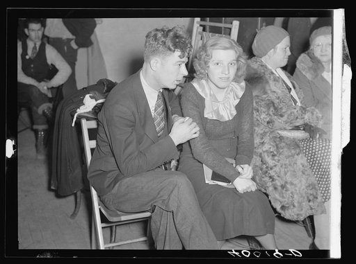 Striker and his fiancee (sitdown strike romance) in the Women's Auxiliary room in Pengally Hall. Flint, Michigan