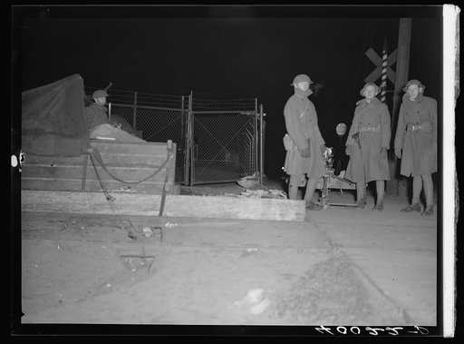 National Guard with machine gun overlooking Chevrolet factories number nine and number four. Flint, Michigan