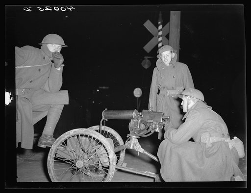 National Guard with machine gun overlooking Chevrolet factories number nine and number four. Flint, Michigan
