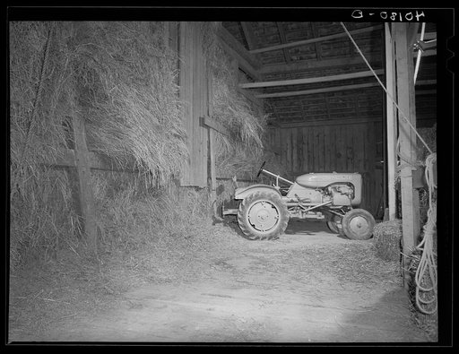 Maytown (vicinity), Lancaster County, Pennsylvania. Tractor in the barn on the farm of FSA (Farm Security Administration) client Jay Reich