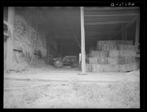 Untitled photo, possibly related to: Maytown (vicinity), Lancaster County, Pennsylvania. Tractor in the barn on the farm of FSA (Farm Security Administration) client Jay Reich