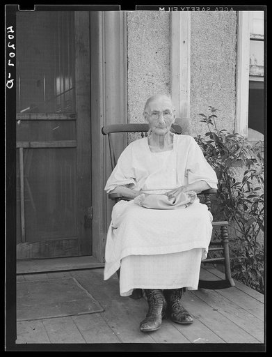 Untitled photo, possibly related to: Barto, Berks County, Pennsylvania. Mrs. Springer, Mrs. Evans grandmother, on the front porch, on the farm of Thomas G. Evans, a FSA (Farm Security Administration) client