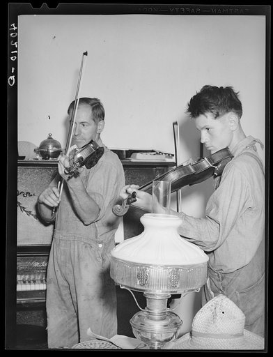 Untitled photo, possibly related to: Barto, Berks County, Pennsylvania. Thomas Evans, a FSA (Farm Security Administration) client, giving a violin lesson to one of the neighbor's boys