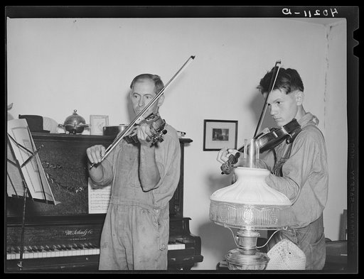 Barto, Berks County, Pennsylvania. Thomas Evans, a FSA (Farm Security Administration) client, giving a violin lesson to one of the neighbor's boys
