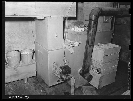 Lancaster County, Pennsylvania. The heating plant for the chicken house, and moisturater to keep the eggs fresh on the Enos Royer farm