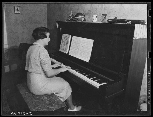 Lancaster County, Pennsylvania. Martha Royer playing the piano on the Enos Royer farm